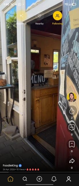 Foodie redesigned dark-theme vertical video feed with Foodie AI, Nearby, and Following tabs
